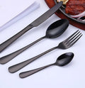 Luxury gold-plated stainless steel steak cutlery set with black matte finish and modern minimalist polished bowls