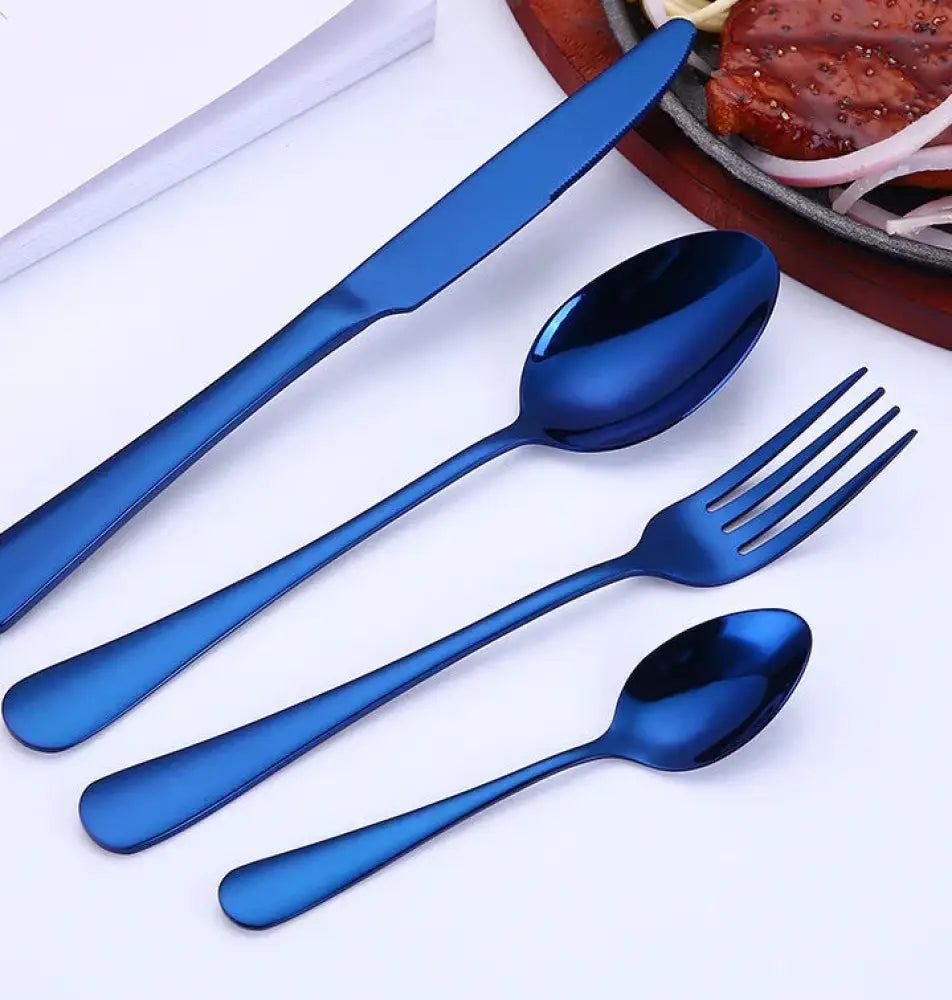 Set of four blue stainless steel cutlery including knife two spoons and fork for luxury gold-plated steak use