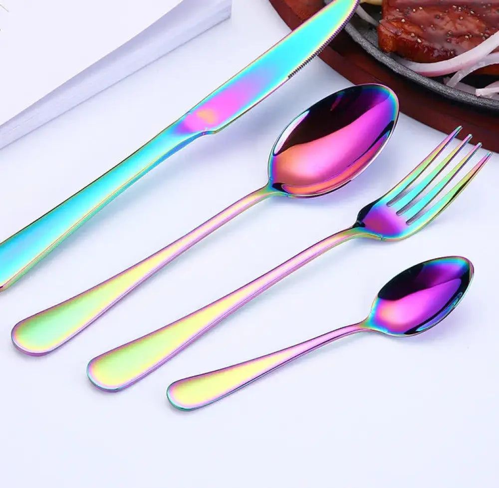 Luxury gold plated stainless steel steak cutlery set with rainbow finished knife fork and spoons with reflective surfaces