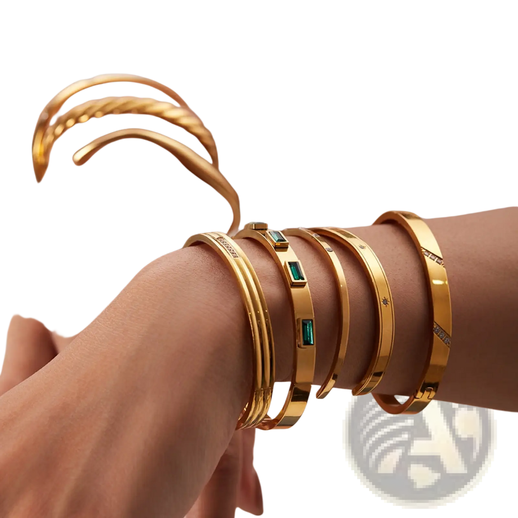 Gold plated stainless steel bangle bracelet with emerald green rectangular stones and diamond zirconia accents