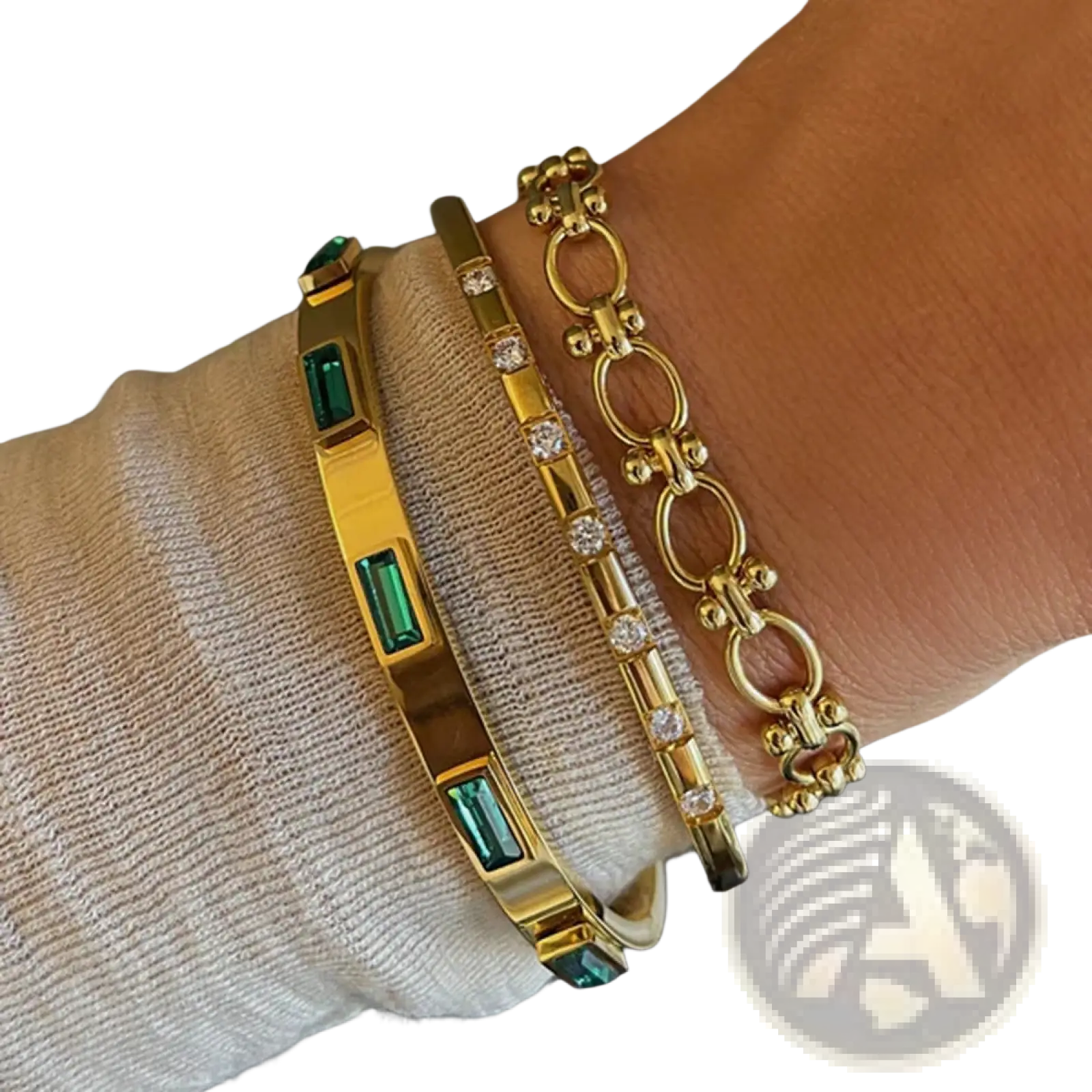 Gold plated stainless steel bangle bracelet with rectangular emerald green zirconia gemstones in a gold tone