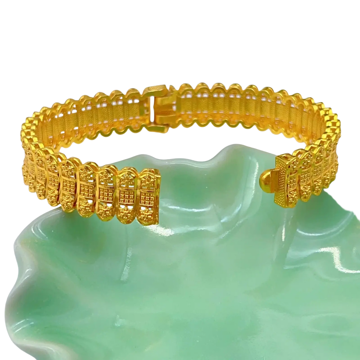 Gold plated zinc alloy bangle bracelet with intricate repeating geometric patterns and secure clasp hand jewelry