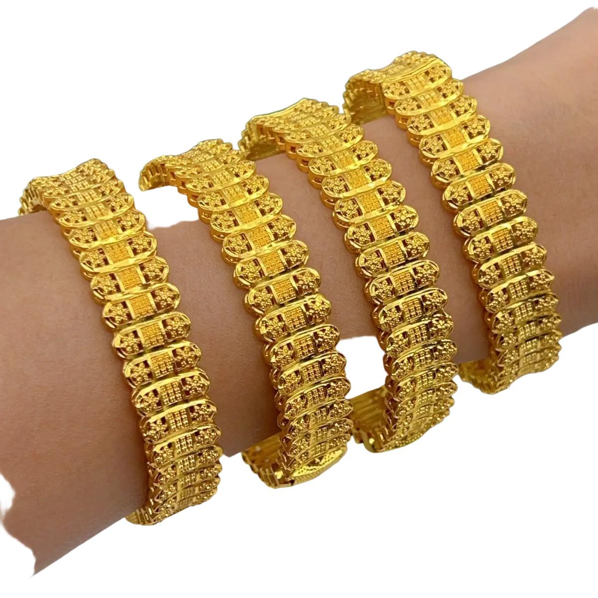 Gold plated zinc alloy bangle bracelets featuring golden intricately engraved textured hand jewelry on a wrist