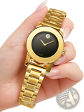 Gold quartz watch with a gold-tone stainless steel bracelet black dial and diamond accent logo at 12 o’clock position