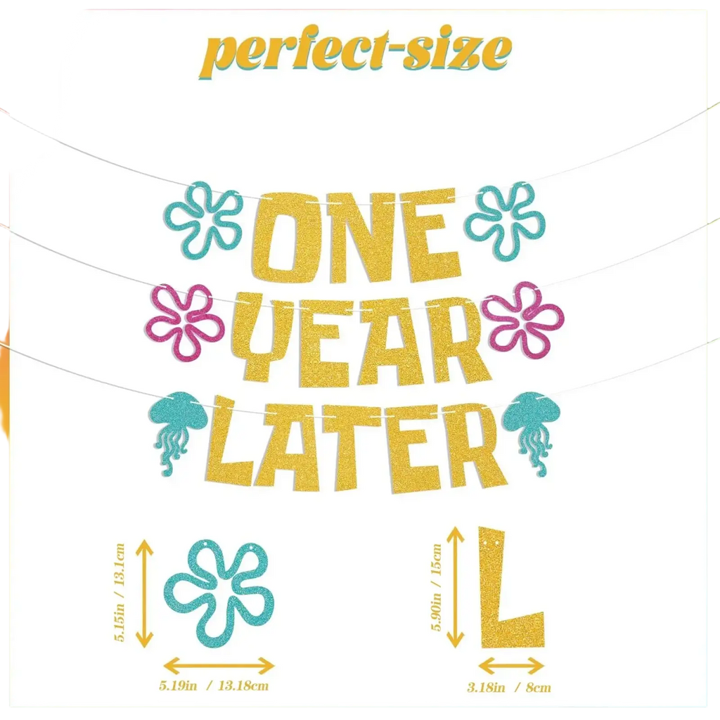 Glittery gold one year later banner with teal and pink floral accents and jellyfish for sea animal first birthday decor