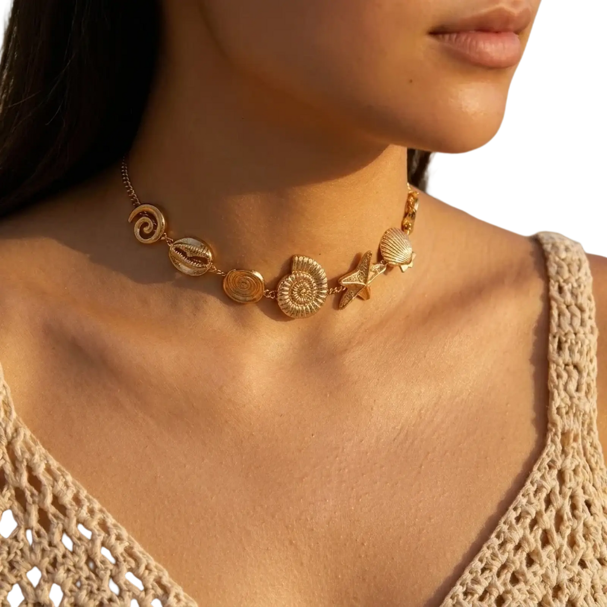 Gold-toned choker necklace with intricate seashell starfish and spiral motifs for elegant beach-inspired wear