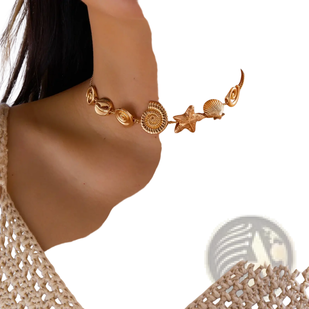 Gold seashell starfish choker necklace featuring gold-toned intricate sea-themed charms including shells starfish and ammonite
