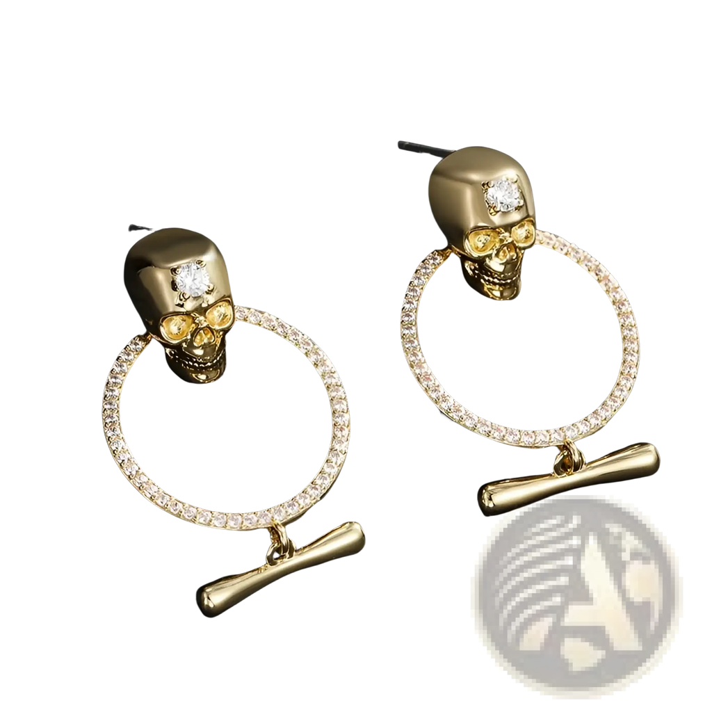 Gold skull tassel earrings with zircon accents featuring gold skulls, diamond-encrusted hoops, and bone toggle clasps