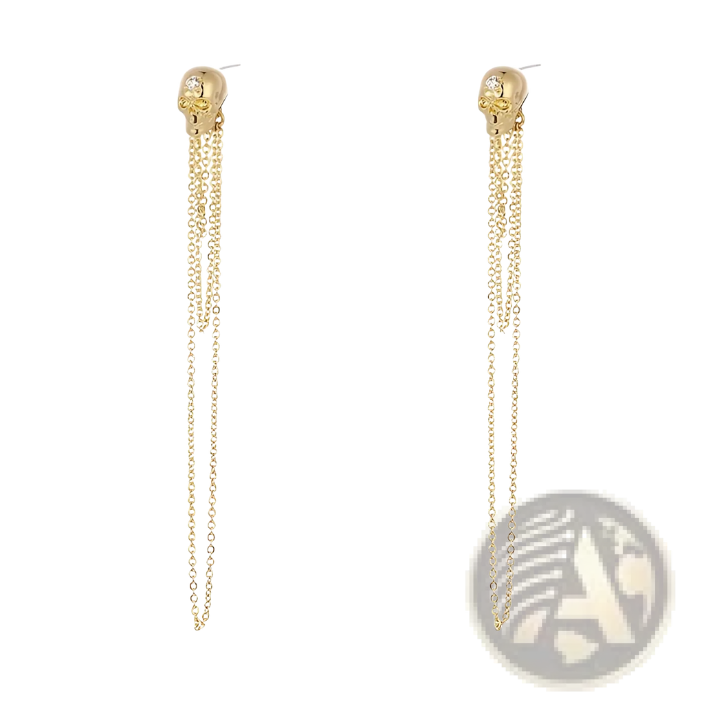 Gold skull tassel earrings with dangling chains and zircon accents featuring a small gemstone on the forehead