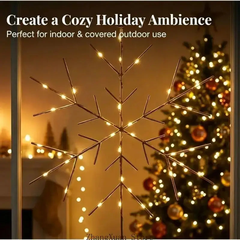 Gold snowflake christmas tree and wreath ornament with glowing warm white led bulbs on metallic branches
