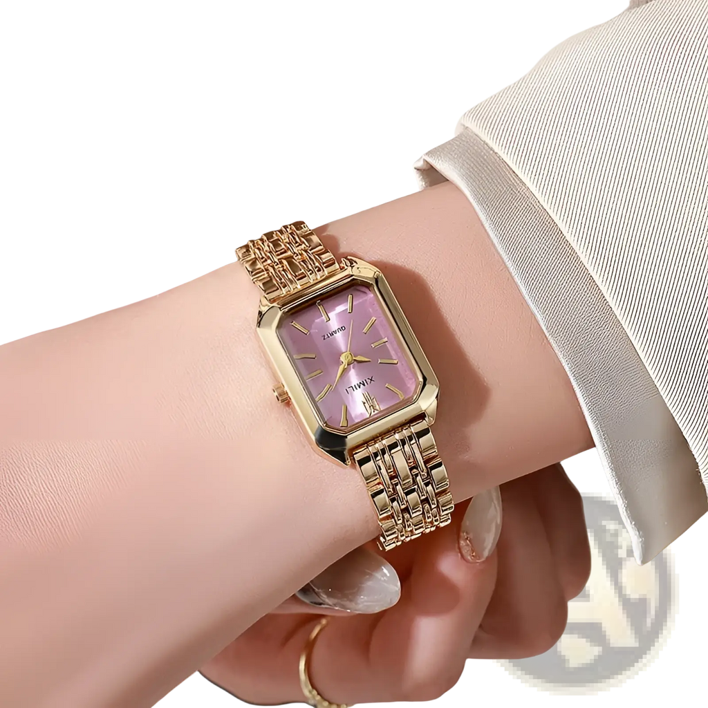 Gold square quartz watch with lavender dial and linked gold-toned stainless steel band worn on wrist