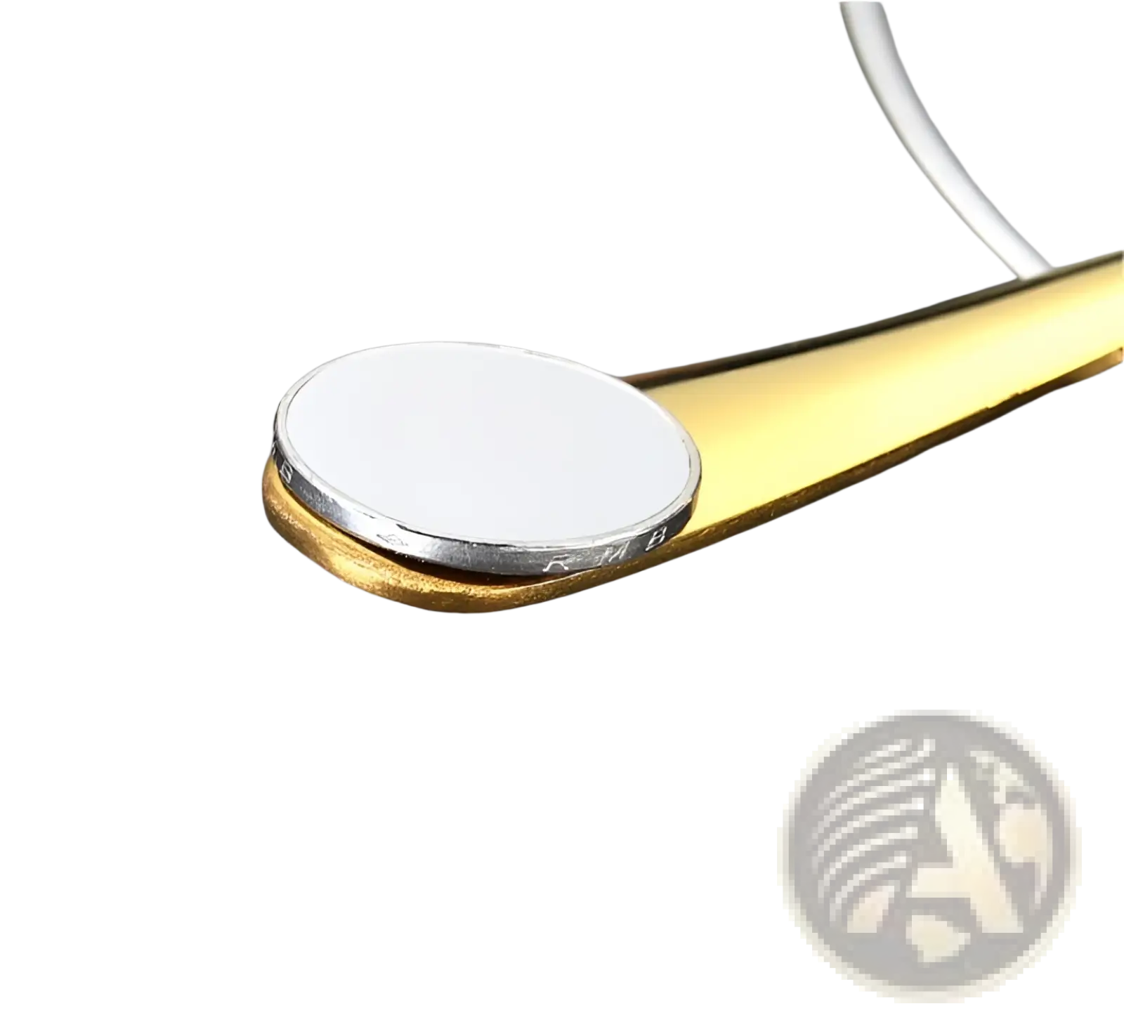 Gold stainless steel spoon with round white and silver-edged head from 24 piece tableware cutlery set