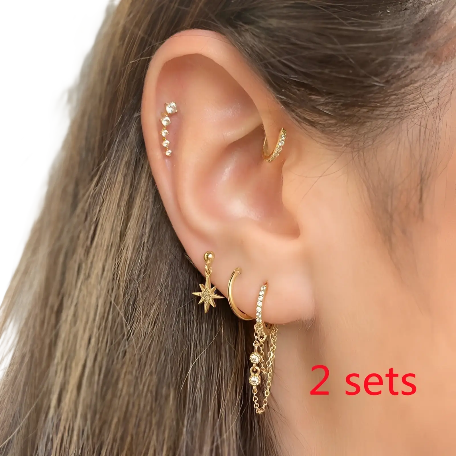 Gold star and moon butterfly earring and cuff set featuring gold-toned diamond-studded hoops chains and star charm