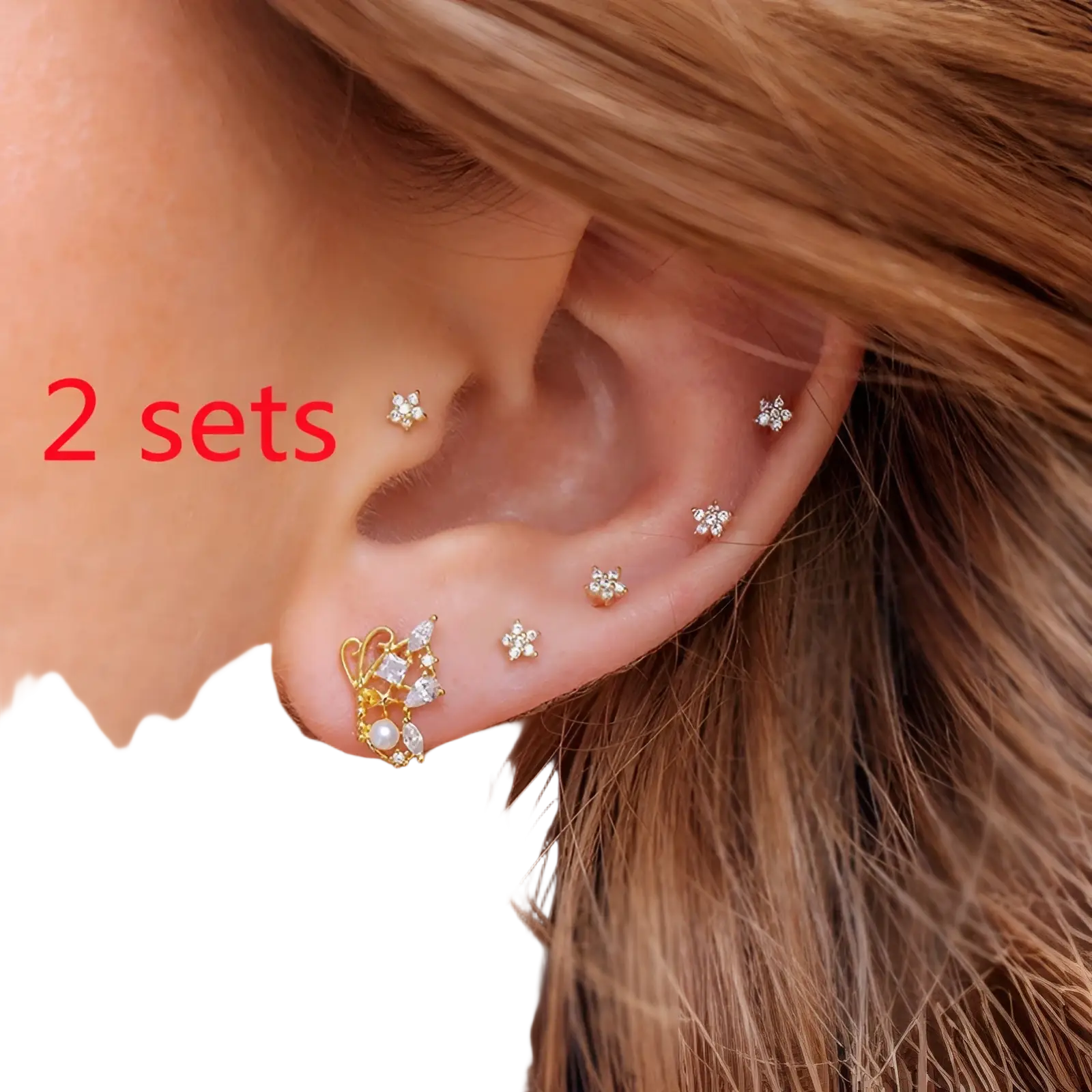 Gold-toned gold star and moon butterfly stud earrings with delicate floral designs and clear crystal accents