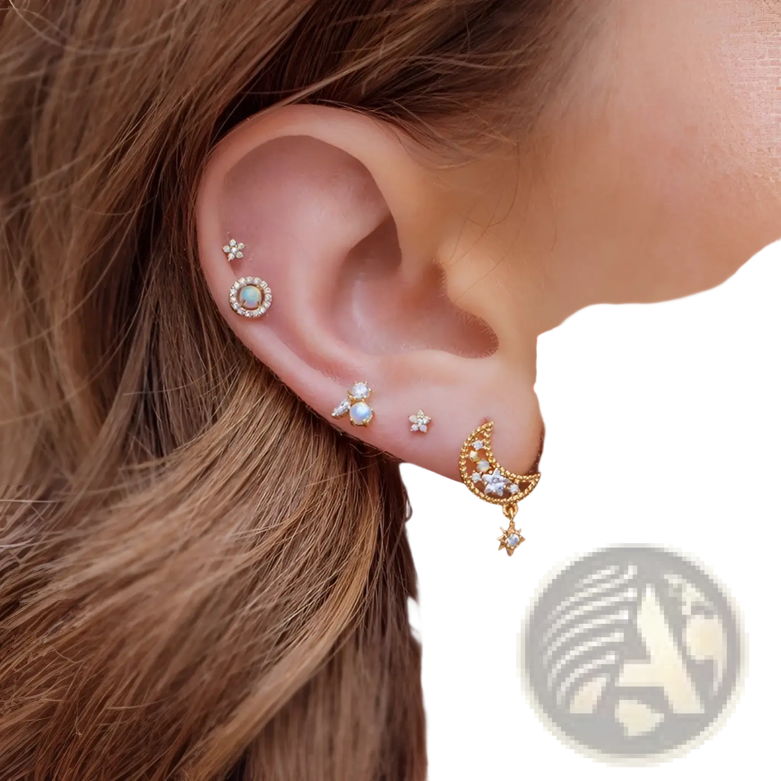 Gold star and moon butterfly earring and cuff set featuring gold-toned crescent moon studs with opal center and crystal accents