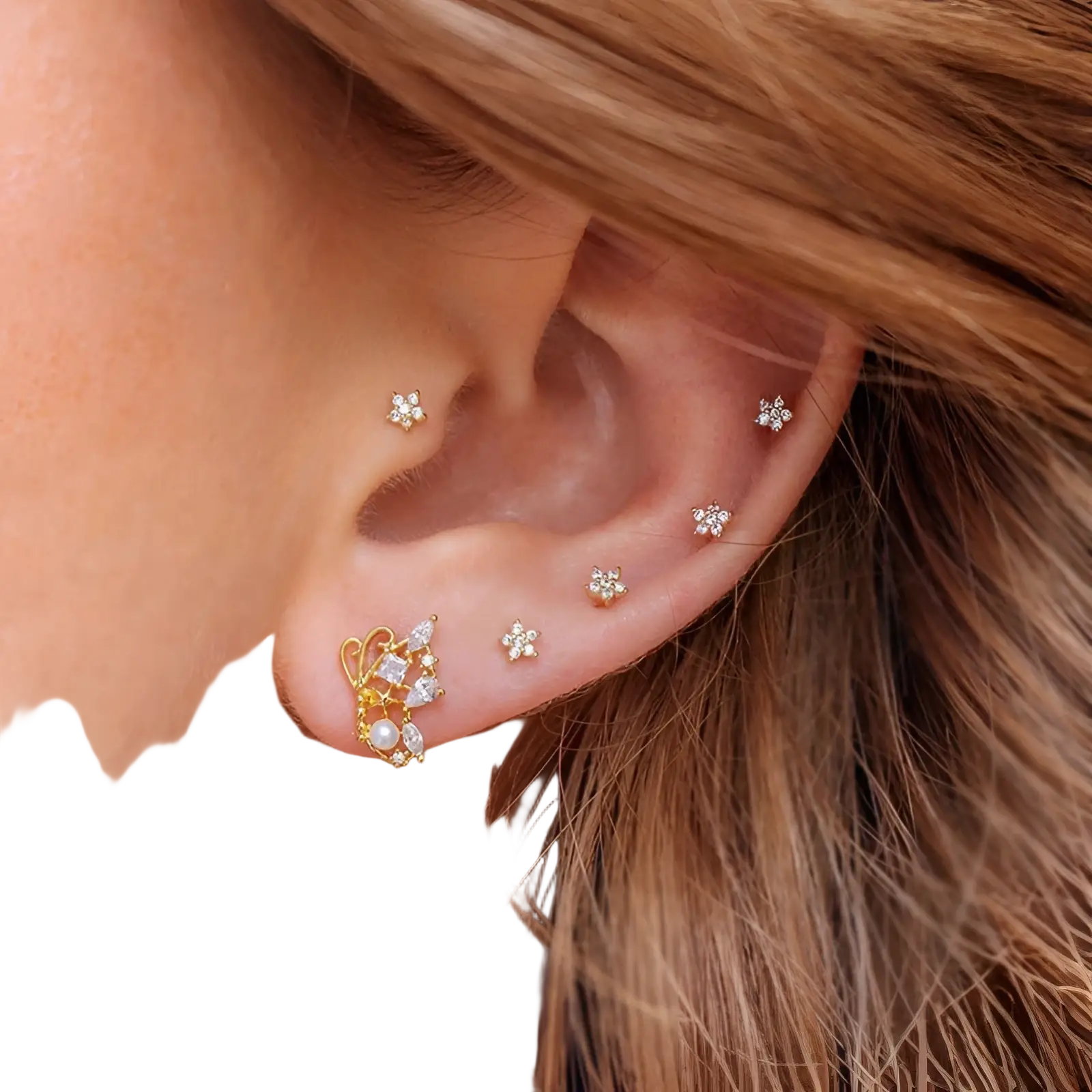Gold-toned butterfly-shaped earring with clear crystals and pearl accent from gold star and moon cuff set