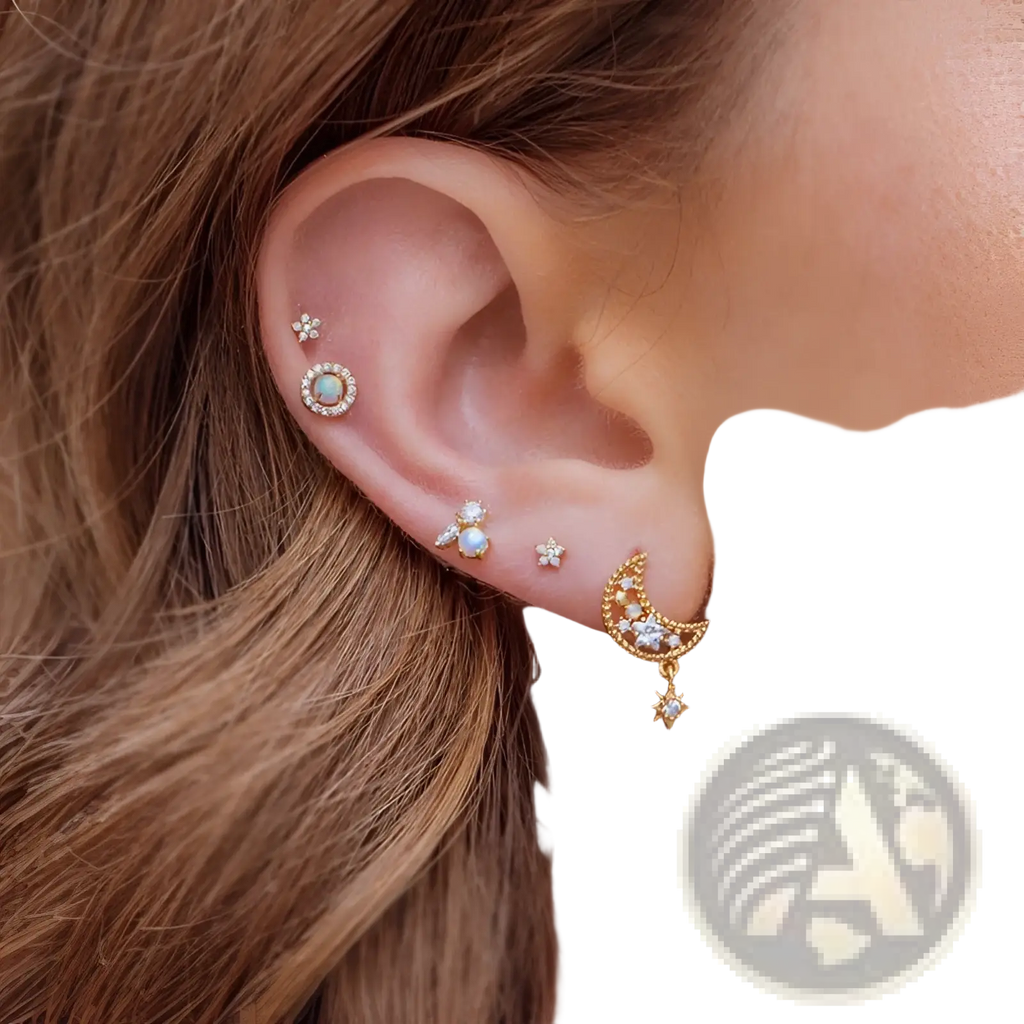 Gold star and moon butterfly earring and cuff set with gold-toned celestial design featuring opal center stud and floral accents
