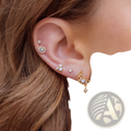 Gold star and moon butterfly earring and cuff set with gold-toned celestial design featuring opal center stud and floral accents