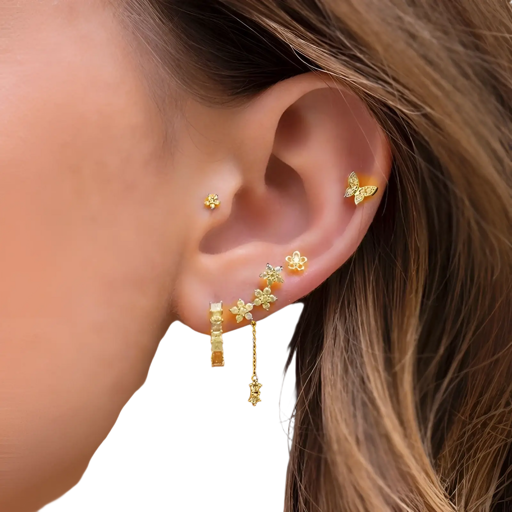 Gold-toned butterfly-shaped ear cuff with sparkling gemstone accents from gold star and moon earring and cuff set