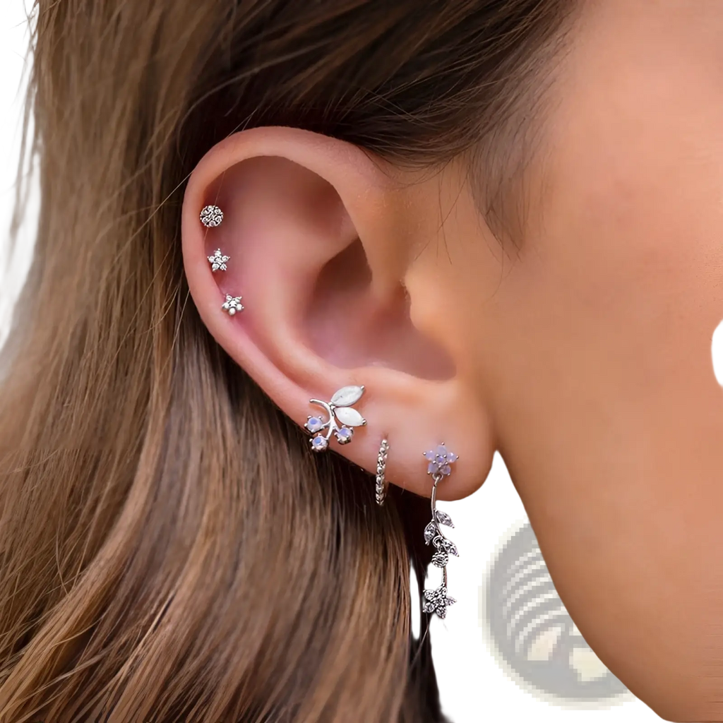 Silver floral ear cuff with embedded crystals and delicate leaf design from gold star and moon butterfly earring set