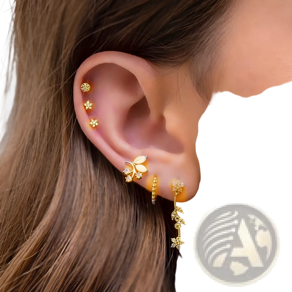 Gold-toned floral ear cuff from the gold star and moon butterfly earring and cuff set with delicate leaf and gemstone detailing