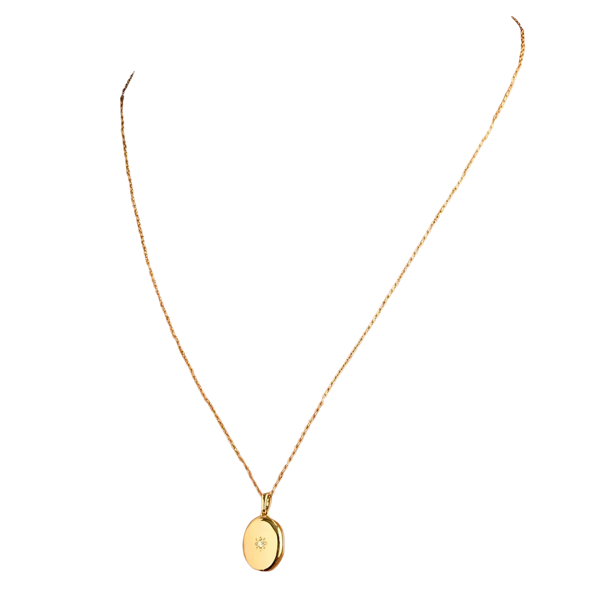 Gold starburst locket necklace gold-toned oval pendant with delicate chain and small diamond accent at center