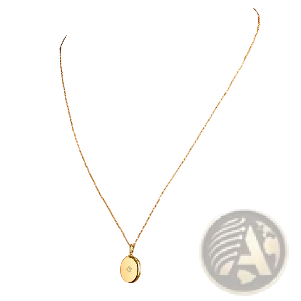 Gold starburst locket necklace gold-toned oval pendant with delicate chain and small diamond accent at center