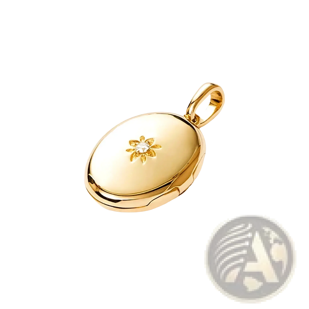 Gold starburst locket necklace with a gold-toned oval pendant featuring a delicate starburst design and central diamond