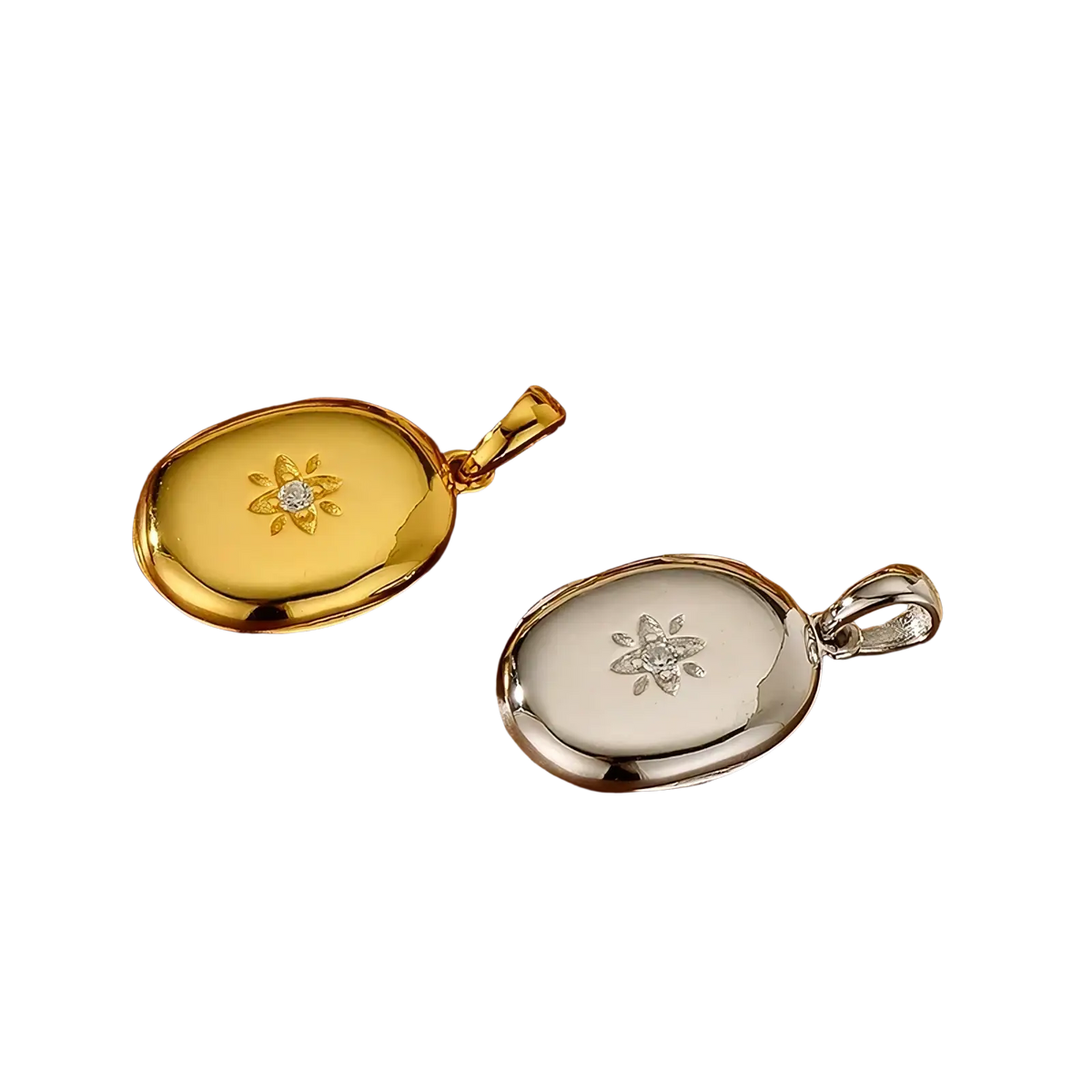 Two oval locket pendants in yellow gold with sunburst diamond and white gold with engraved snowflake patterns