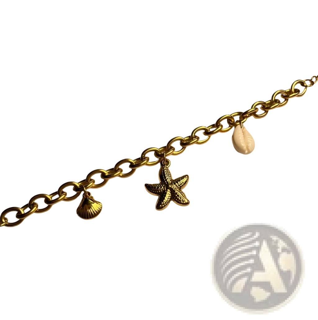 Gold-toned chain bracelet with starfish charm seashell charm and natural cowrie shell ocean-inspired design