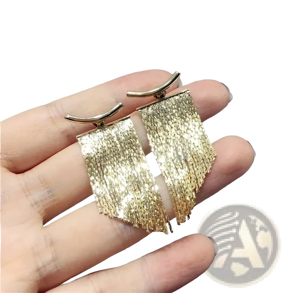 Gold tassel fringe statement earrings with shimmering gold color textured metallic finish and curved hooks