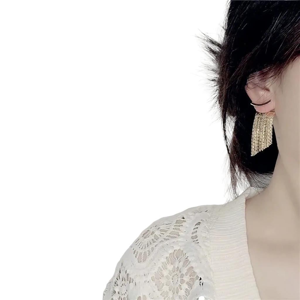 Gold tassel fringe statement earrings with gold-toned metal and cascading fringe of small sparkling crystals