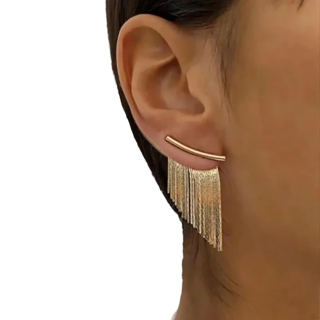 Gold tassel fringe statement earrings featuring a gold-toned curved bar with dangling metallic tassels