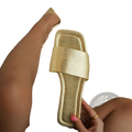 Gold textured flat slide sandal with square toe and strap design perfect for casual wear