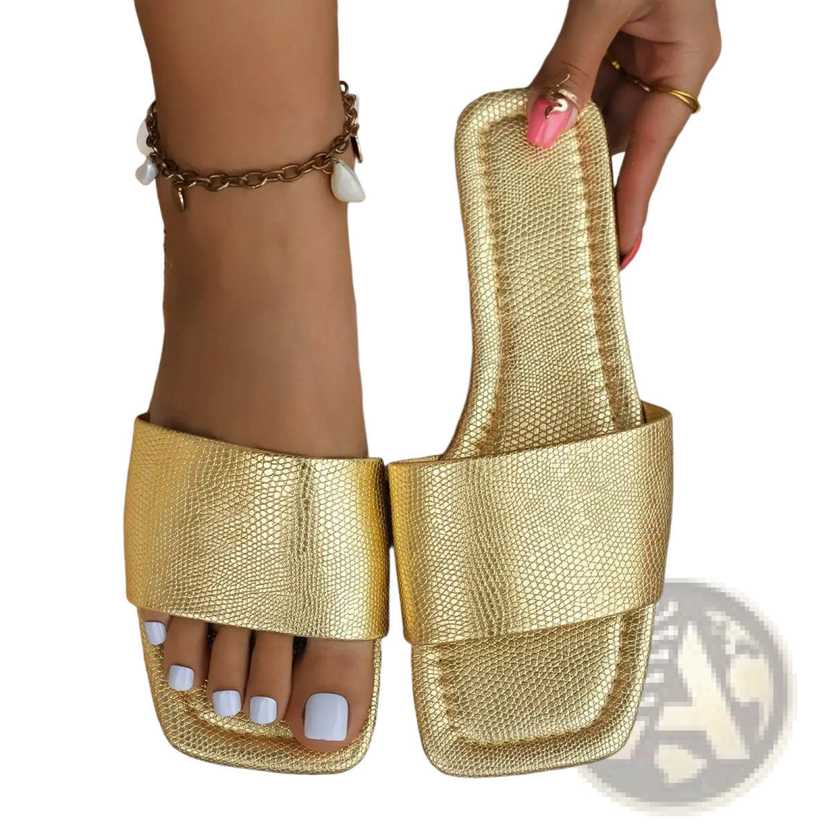Gold textured square toe flat slide sandals with a sleek reptile-skin pattern and luxurious gold color