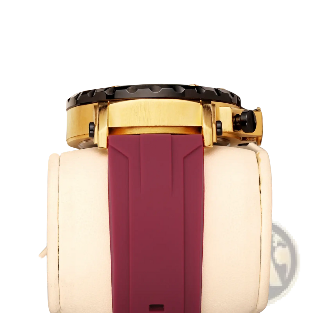 Gold tone sport watch with black bezel and burgundy silicone rubber strap featuring chronograph function