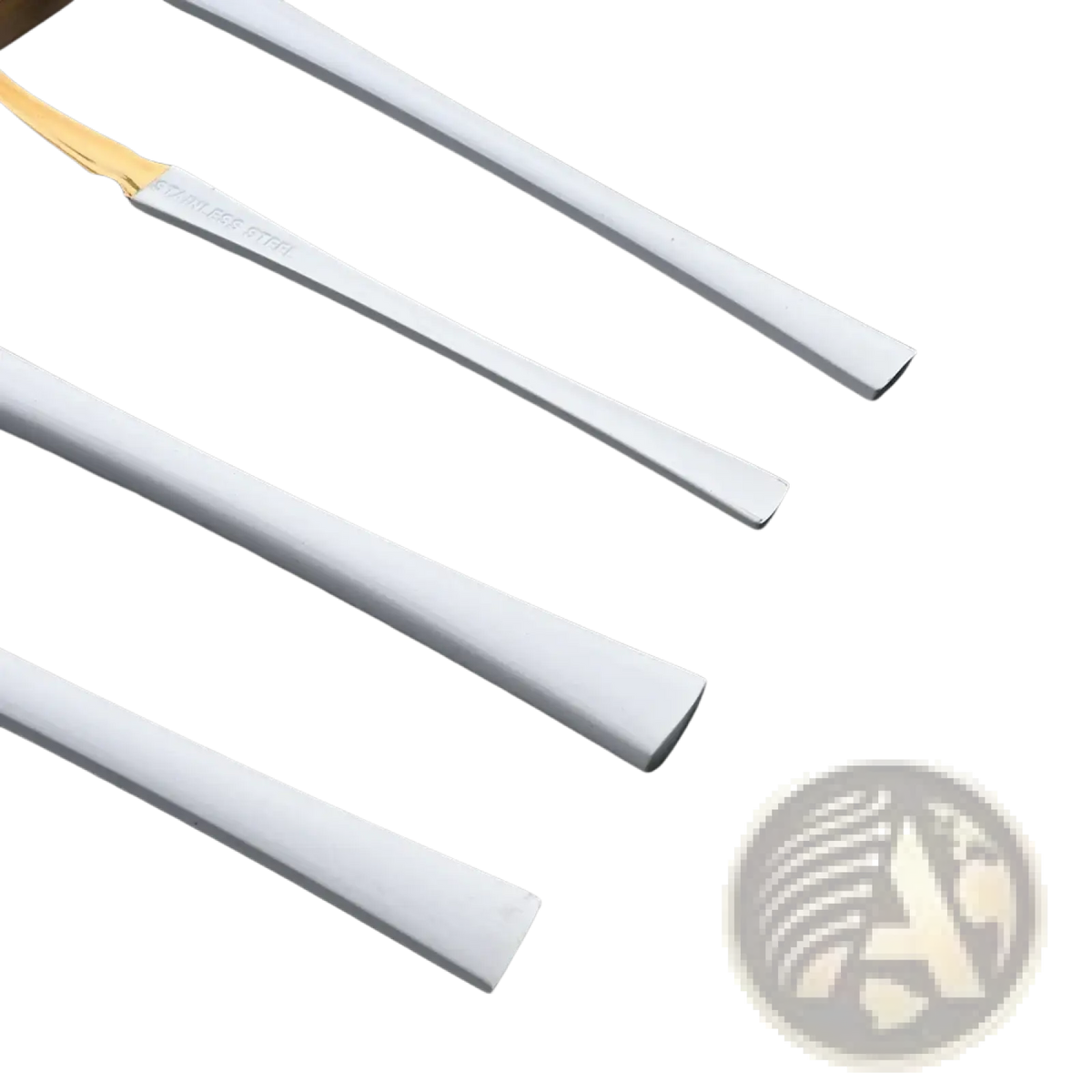 White stainless steel dessert spoons with gold-colored handles from the gold and white stainless steel 16 piece flatware set