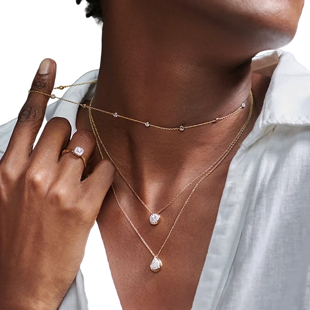 Delicate rose gold sterling silver necklace set with layered chains, diamonds, teardrop zircon pendant, and adjustable length