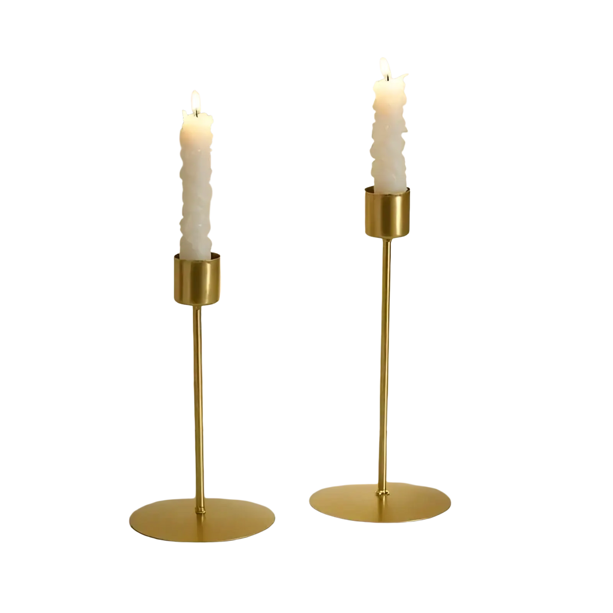 Two elegant gold-toned metal candle holders with slender stems and white textured taper candles for home decor