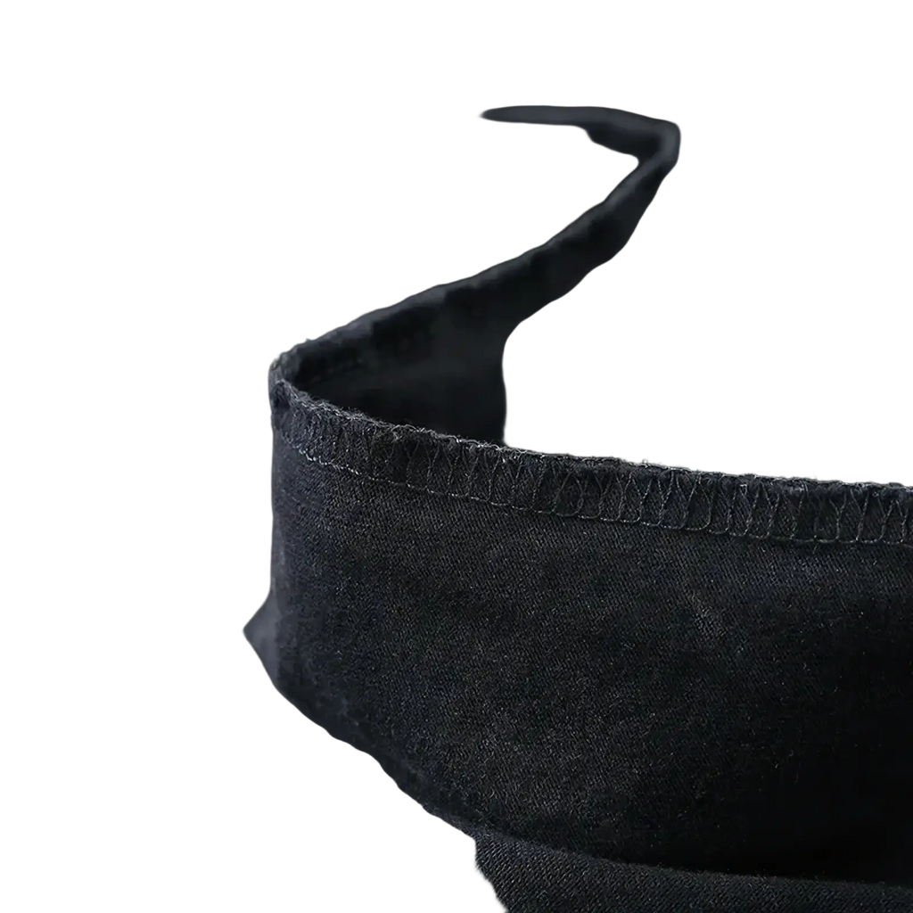 Dark gray denim fabric with worn texture and stitching on the gothic anime graphic oversized vintage washed t-shirt