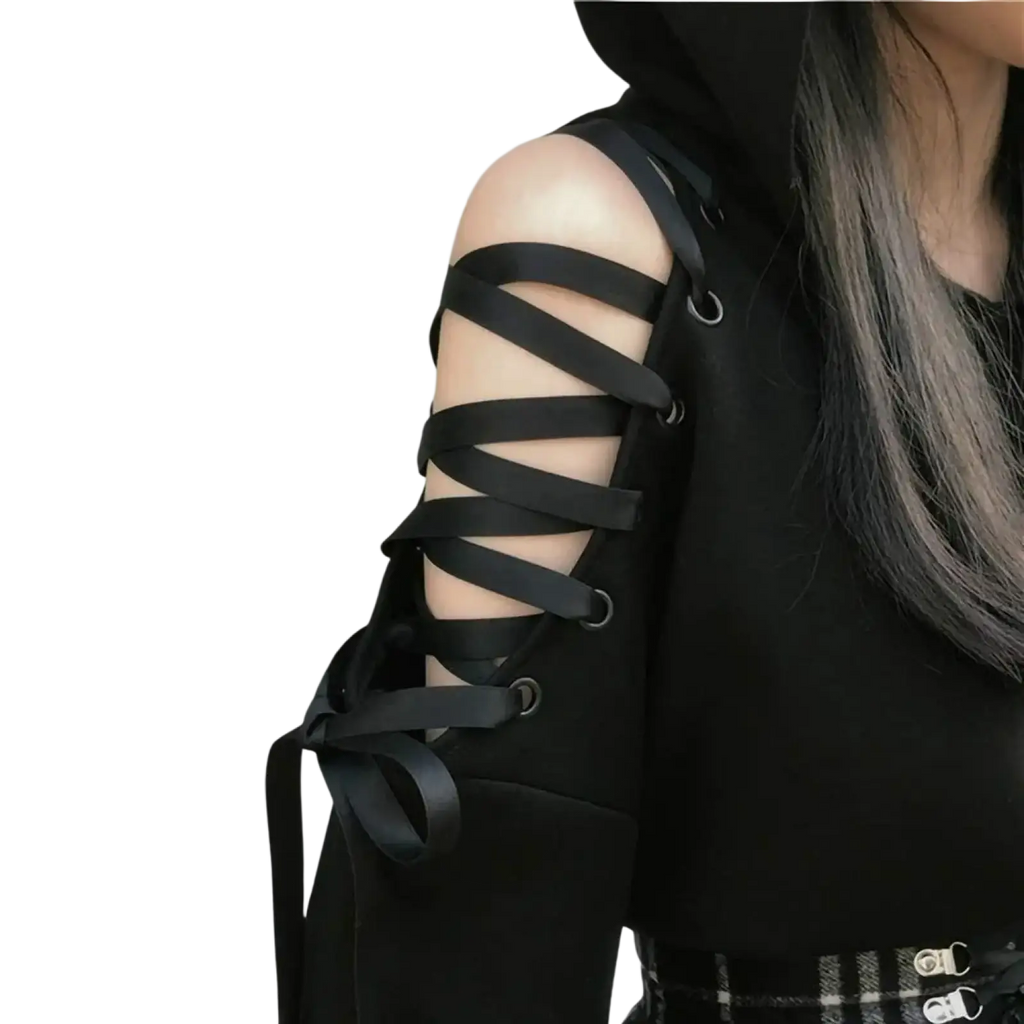 Black lace-up arm strap with metallic eyelets on gothic cat ear cold shoulder hoodie made of soft fabric