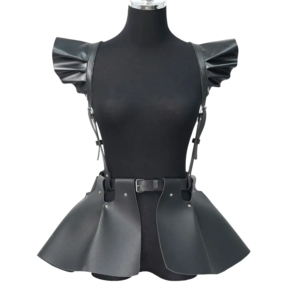 Black faux leather gothic harness skirt with ruffled shoulder straps and flared peplum hem in front view