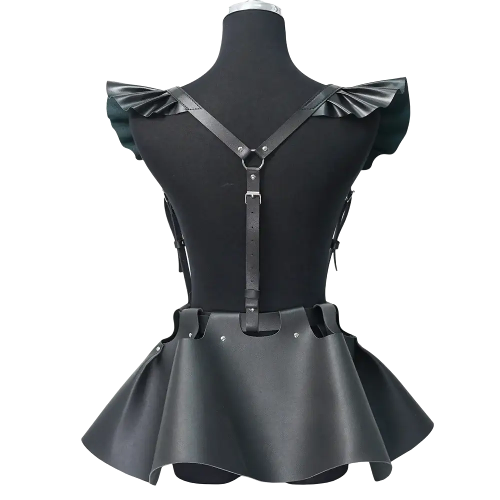 Black faux leather gothic harness skirt featuring a corset design with ruffled shoulder straps and flared hem