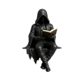 Black hooded gothic reader figurine seated with book featuring detailed sculptural design for spooky bookshelf display