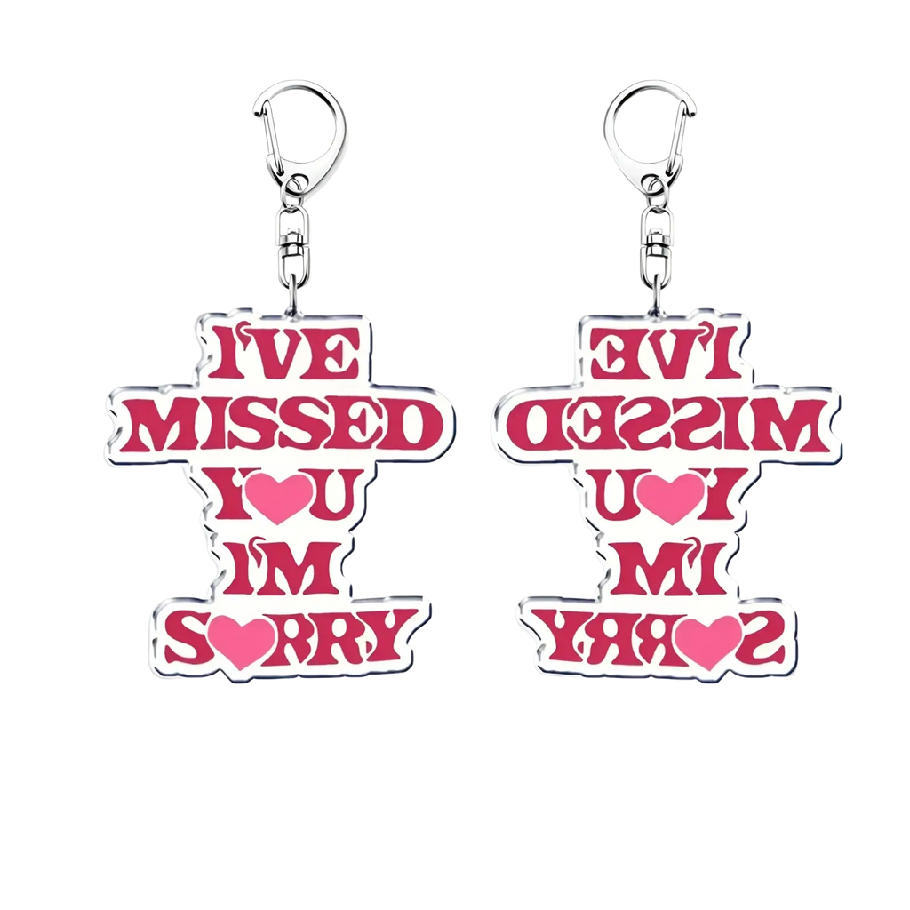 Pink acrylic Gracie Abrams keychain with white outline and silver clip featuring bold ive missed you im sorry text
