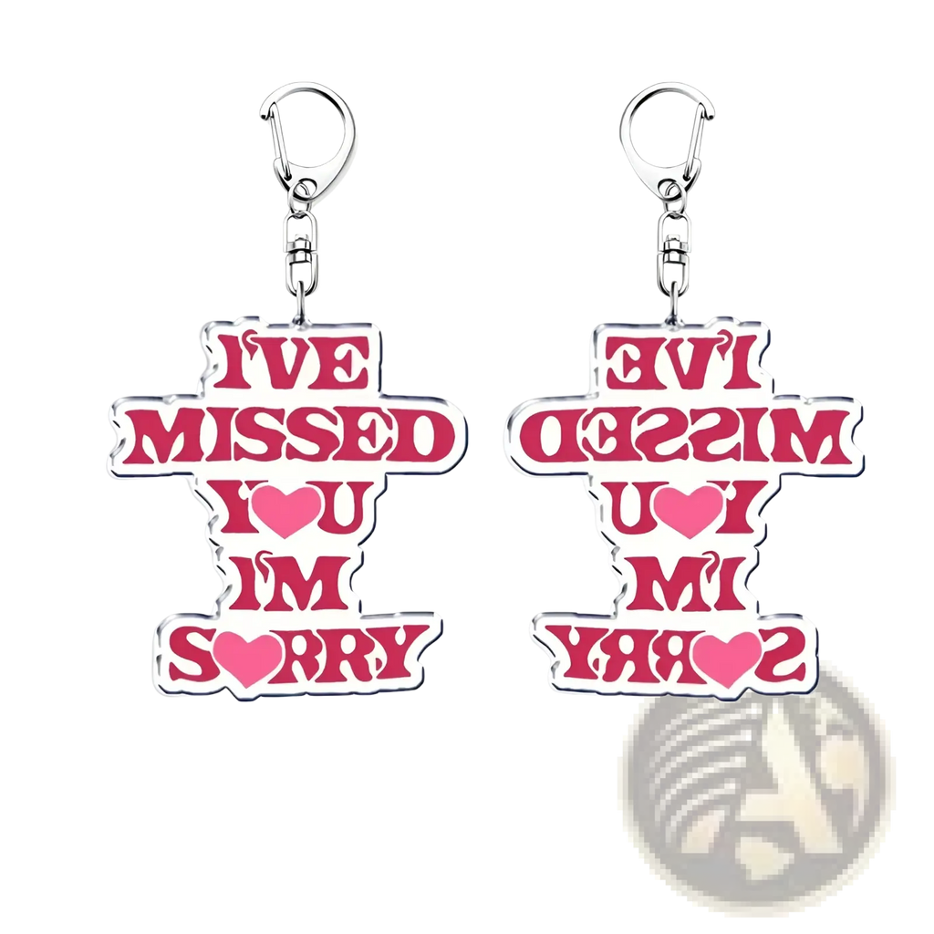 Pink acrylic Gracie Abrams keychain with white outline and silver clip featuring bold ive missed you im sorry text