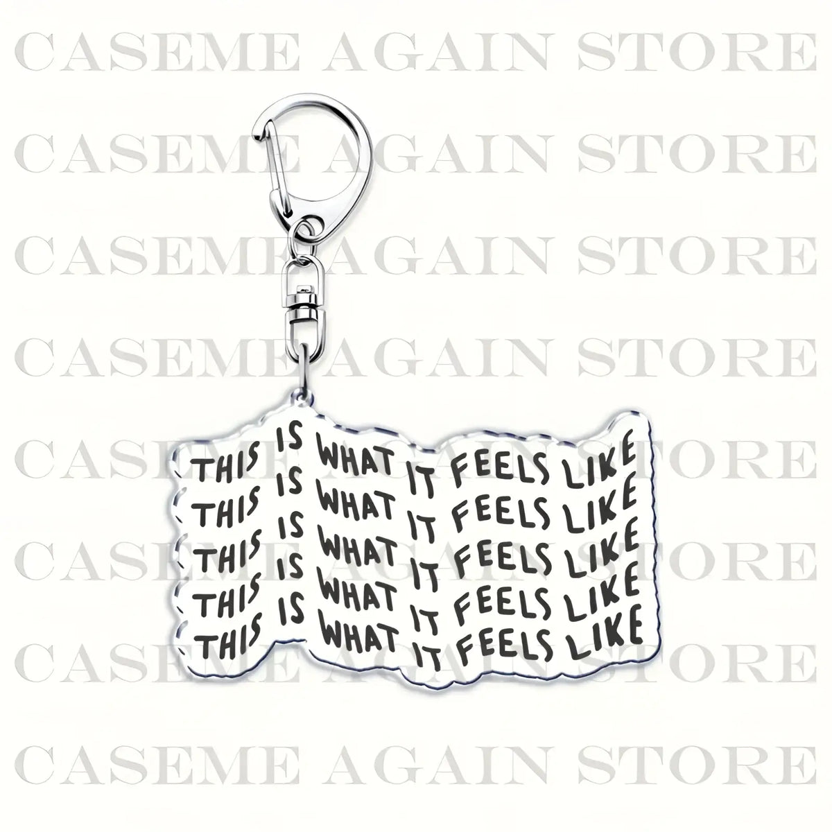 Silver metallic acrylic keychain with wavy rectangular charm and black bold this is what it feels like text for anime fans