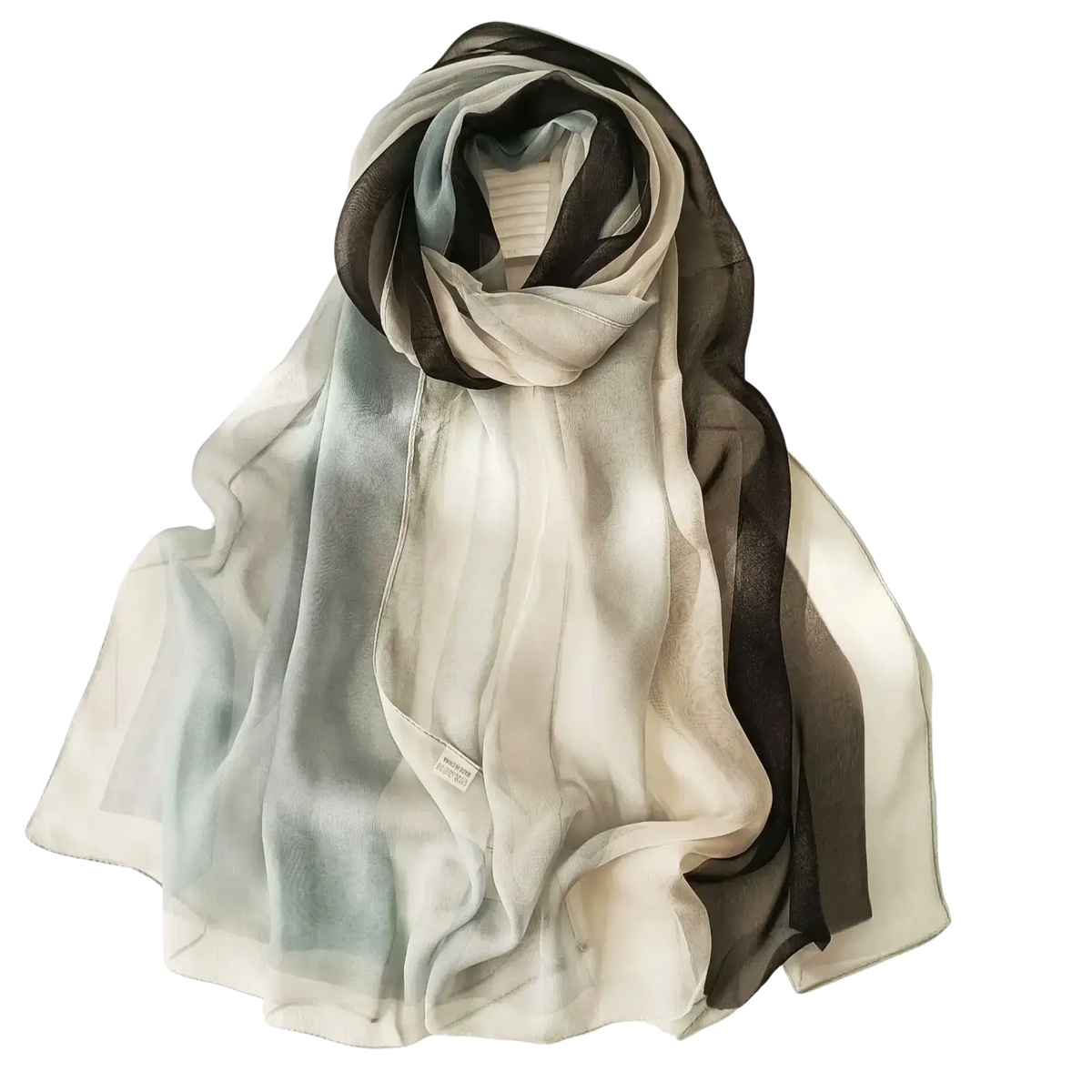 A flowing chiffon beach scarf shawl hijab in gradient cream, light blue, and dark gray hues for versatile wear