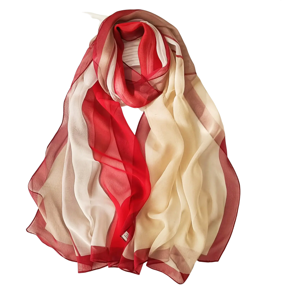 A gradient chiffon beach scarf shawl hijab with vibrant red to cream hues and delicate vertical stripes on edges