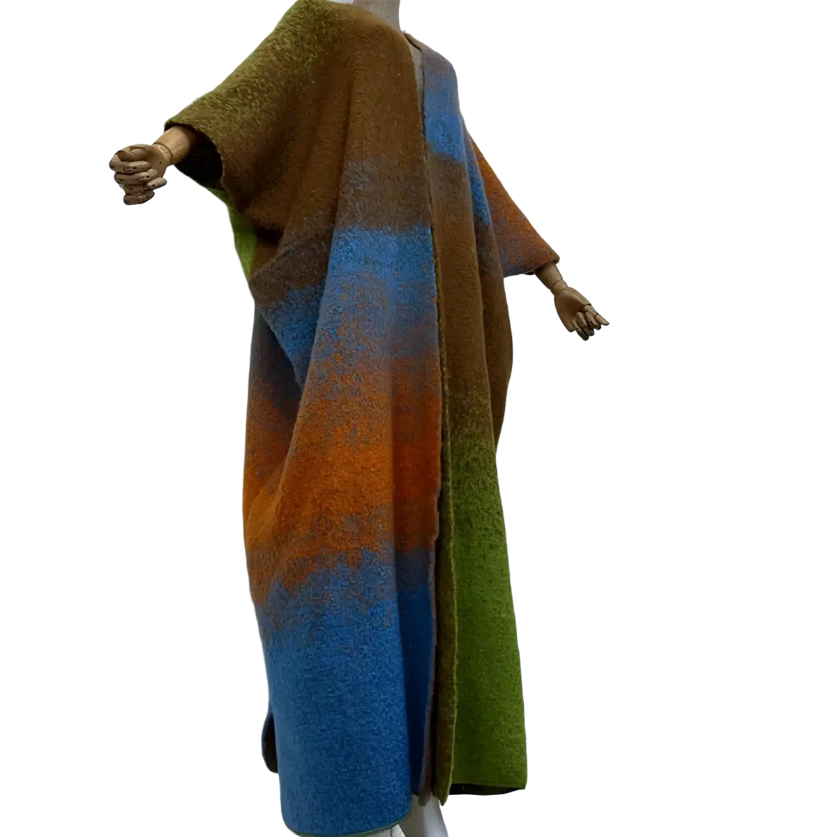 A cozy gradient knit wool cape coat with vibrant brown blue orange and green hues in a soft textured wool blend